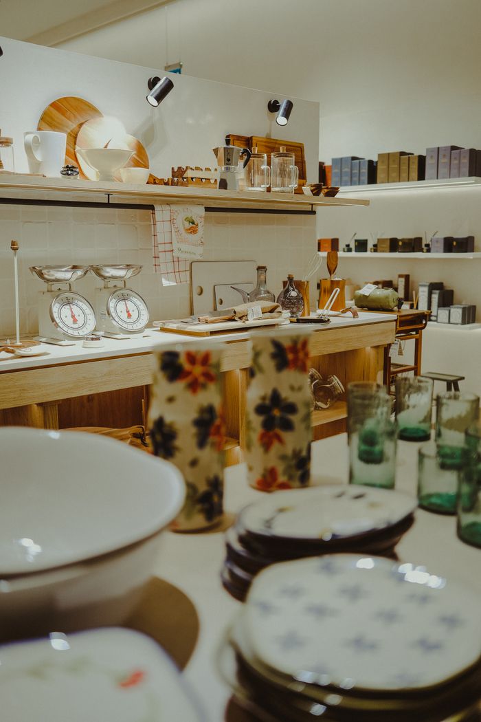 services-02 Charming kitchen scene featuring vintage scales and floral ceramics.